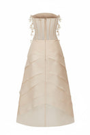 Beige Coralie tulle and organza gown by 21Six featuring intricate detailing and a flowing, elegant silhouette.