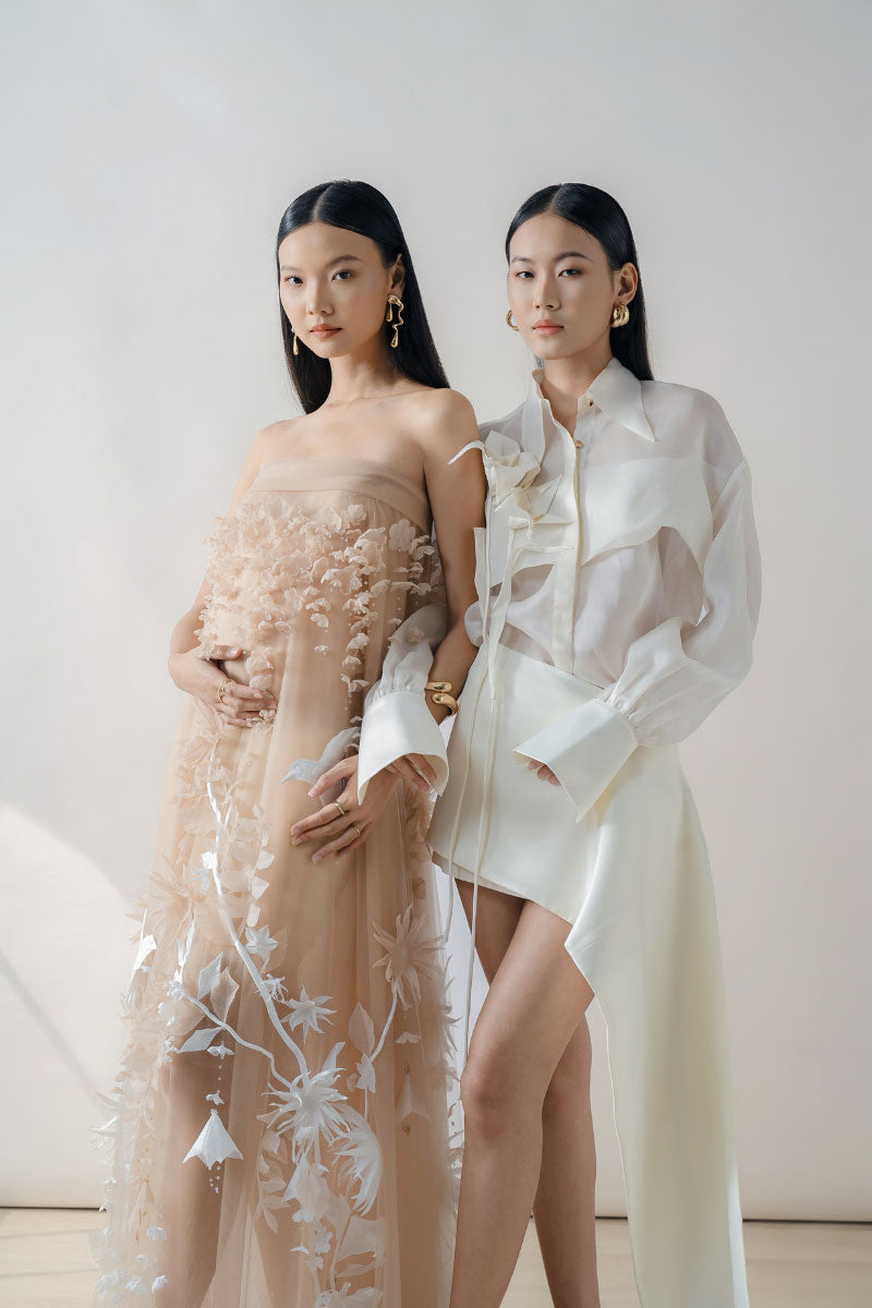 White sheer organza shirt by DOC BAN, showcasing lightweight, transparent fabric with a classic shirt silhouette.