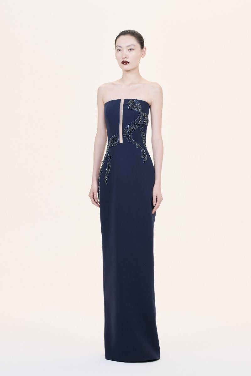 Nihan Peker Statua gown featuring elegant fabric and intricate design, displayed on a mannequin with detailed craftsmanship.
