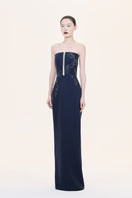 Nihan Peker Statua gown featuring elegant fabric and intricate design, displayed on a mannequin with detailed craftsmanship.
