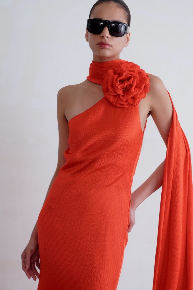 Sisters Marilyn maxi dress in scarlet red, flowing fabric with a fitted bodice and elegant shoulder straps.
