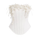 White bouquet corset top by Keira Tong, close-up showing fitted design, floral pattern, and structured bust for stylish tops.