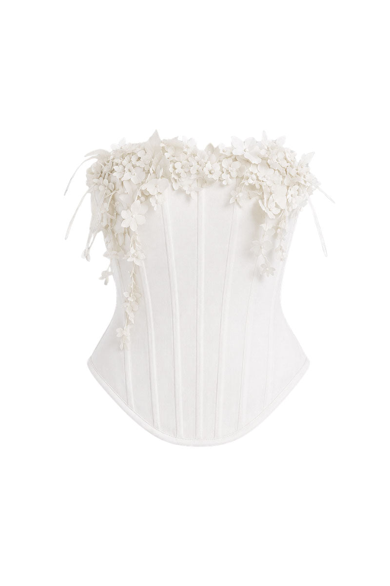 White bouquet corset top by Keira Tong, close-up showing fitted design, floral pattern, and structured bust for stylish tops.