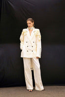 Beige oversized Vaska jacket with rose floral pattern, featuring large lapels and relaxed fit, stylish and cozy outerwear.