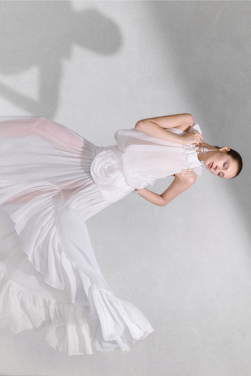 Arti Apparel Salus maxi dress in flowing fabric with a relaxed fit, featuring a stylish neckline and side slit.
