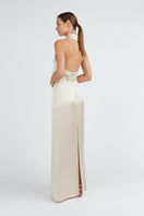 Undress ALIUR champagne halter neck maxi dress with elegant flowing fabric and fitted bodice for evening wear.