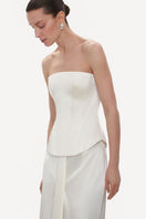 Ivory fitted satin corset top by ELENAREVA, shown with lace-up front and structured bust design.