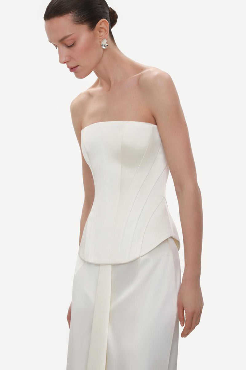 Ivory fitted satin corset top by ELENAREVA, shown with lace-up front and structured bust design.