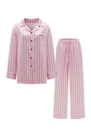Pink striped silk pajama set from Not Just Pajama's Museum of Crush collection, featuring a long sleeve top and matching pants.