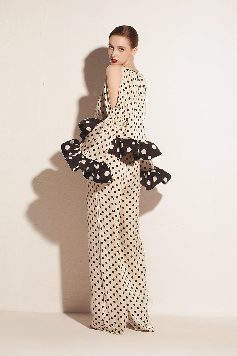 Cream Valenciani ruffle sleeve top with voluminous, layered ruffles on the sleeves and a relaxed fit.