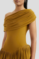 Deme By Gabriella Sabine maxi dress in vibrant ochre yellow, flowing fabric, sleeveless design, and elegant silhouette.