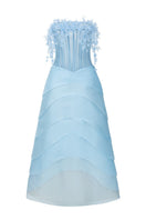 Light blue Coralie tulle and organza gown by 21Six, featuring elegant flowing fabric and intricate detailing.