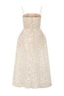 Beige FIORA lace gown by 21Six featuring intricate lace details and elegant flowing fabric.