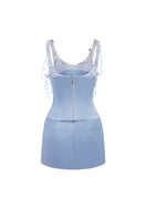 Light blue silk taffeta co-ord set featuring a Delilah top and Marielle skirt from 21Six, displayed on a neutral background.