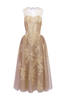 Beige Camilla tulle midi dress by 21Six, featuring layered tulle fabric and elegant design, shown on a model.