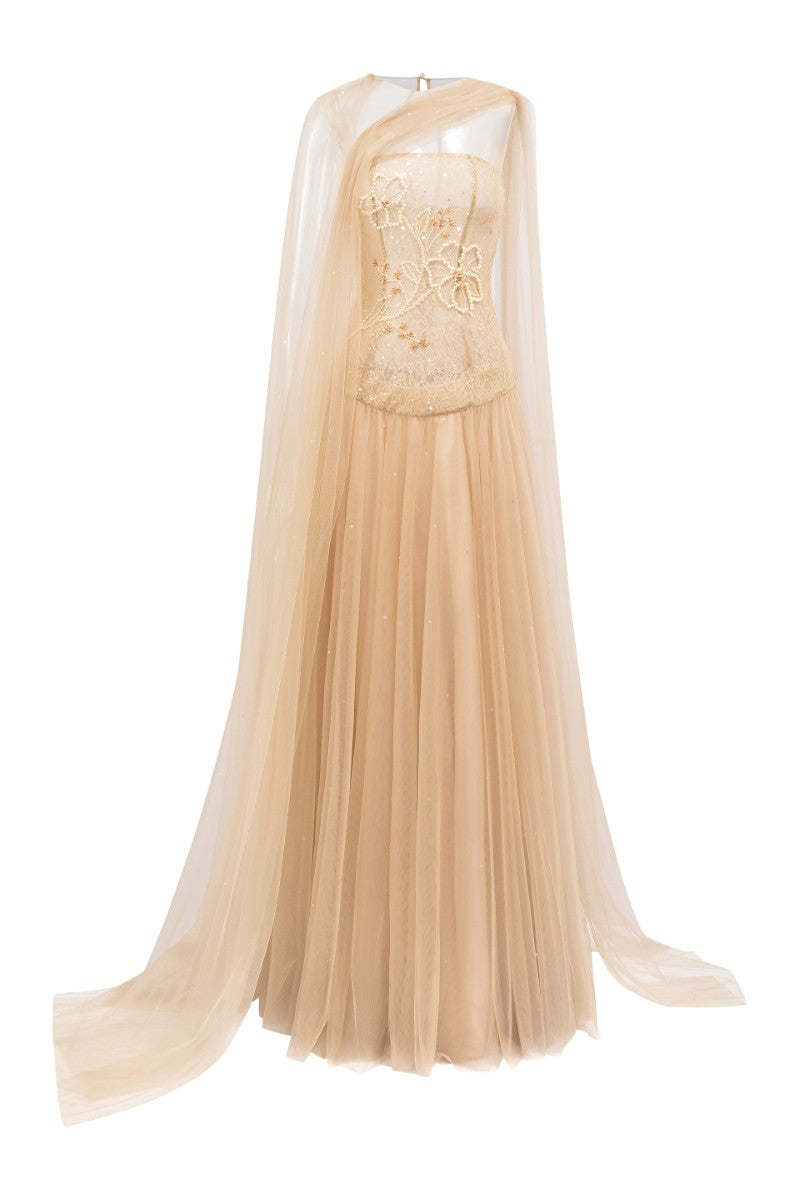 Beige AQAHWAN tulle and lace gown by 21Six, featuring elegant fabric details and a flowing silhouette.