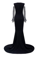 Black Leona crepe gown paired with Vellana tulle gloves, featuring elegant design and flowing fabric for formal occasions.