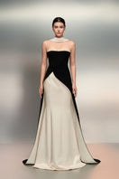 Black and white Lulwa crepe and silk taffeta gown by 21Six, featuring elegant draping and sophisticated design.