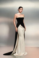 Elegant black and white crepe and silk taffeta gown by 21Six, featuring a flowing silhouette and intricate fabric details.