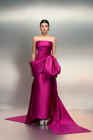 Elegant purple taffeta gown by 21Six, Jawaher Royal style, with intricate details and flowing fabric for formal occasions.