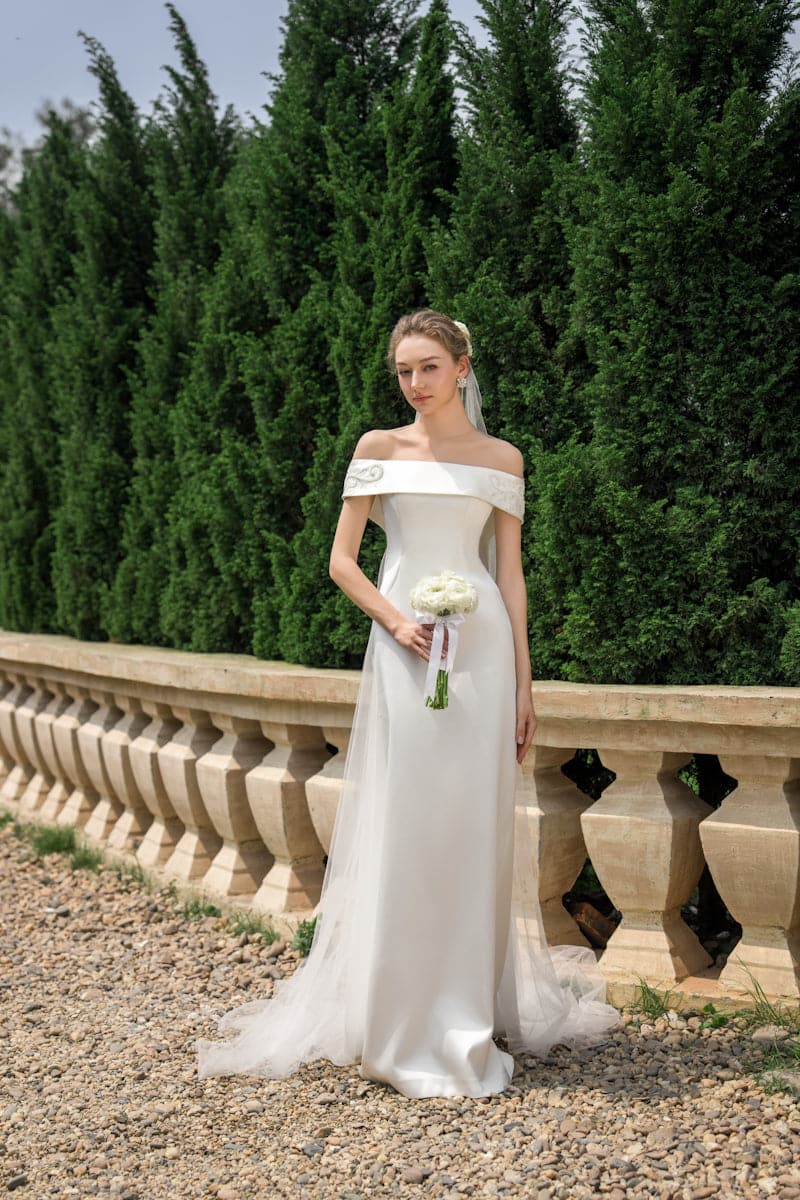 satin maxi wedding dress Satin maxi dress with a voluminous skirt and organza bows Color: White RASARIO Online Boutique 36 (FR) / White