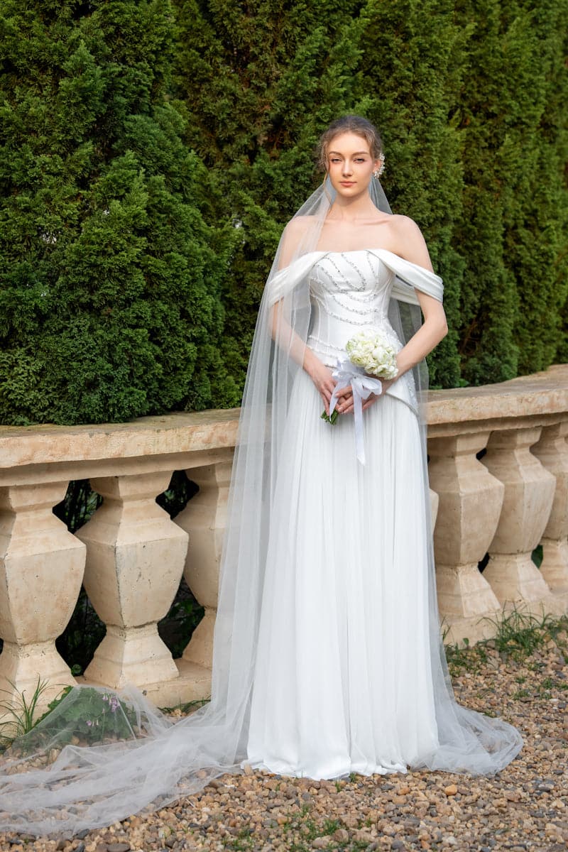 Elegant CULT MIA X 21Six Helena taffeta pleated gown with a flowing silhouette and intricate pleats, perfect for formal occasions.