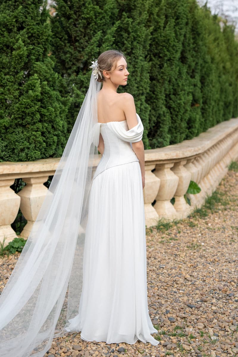 Elegant CULT MIA X 21Six Helena taffeta pleated gown with a flowing silhouette and intricate detailing, perfect for formal occasions.