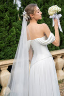 Elegant CULT MIA X 21Six Helena taffeta pleated gown with a flowing silhouette and sophisticated design, perfect for formal occasions.