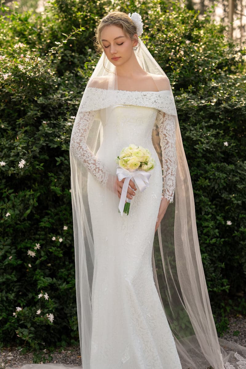 Elegant floral lace crystal gown by 21Six, featuring intricate lace details and sparkling embellishments, suited for formal occasions.