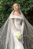 Elegant floral lace crystal gown by 21Six, featuring intricate lace details and sparkling embellishments, designed for formal occasions.
