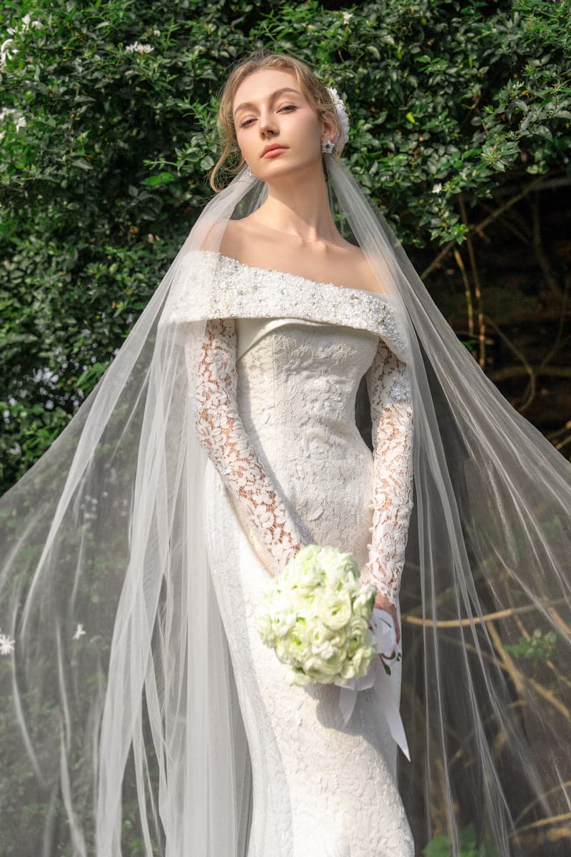 Elegant floral lace crystal gown by 21Six, featuring intricate lace details and sparkling embellishments, designed for formal occasions.