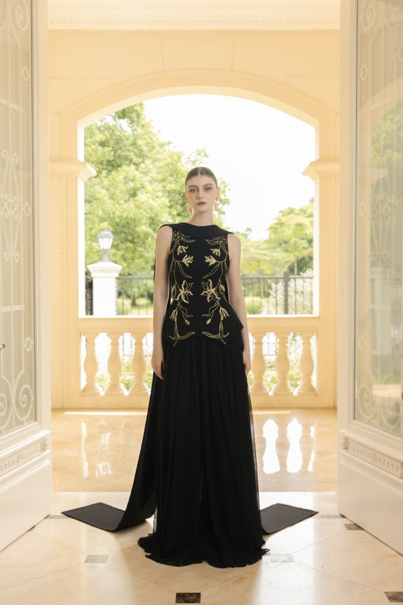 Black Ariane crepe and chiffon gown by 21Six, flowing design with elegant draping and layered fabric for formal occasions.