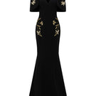 Black Isabelle crepe gown with Emmanuelle cape by 21Six, featuring flowing fabric and elegant design.
