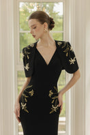 Black Isabelle crepe gown with Emmanuellette cape by 21Six, elegant evening wear with flowing fabric and sophisticated design.