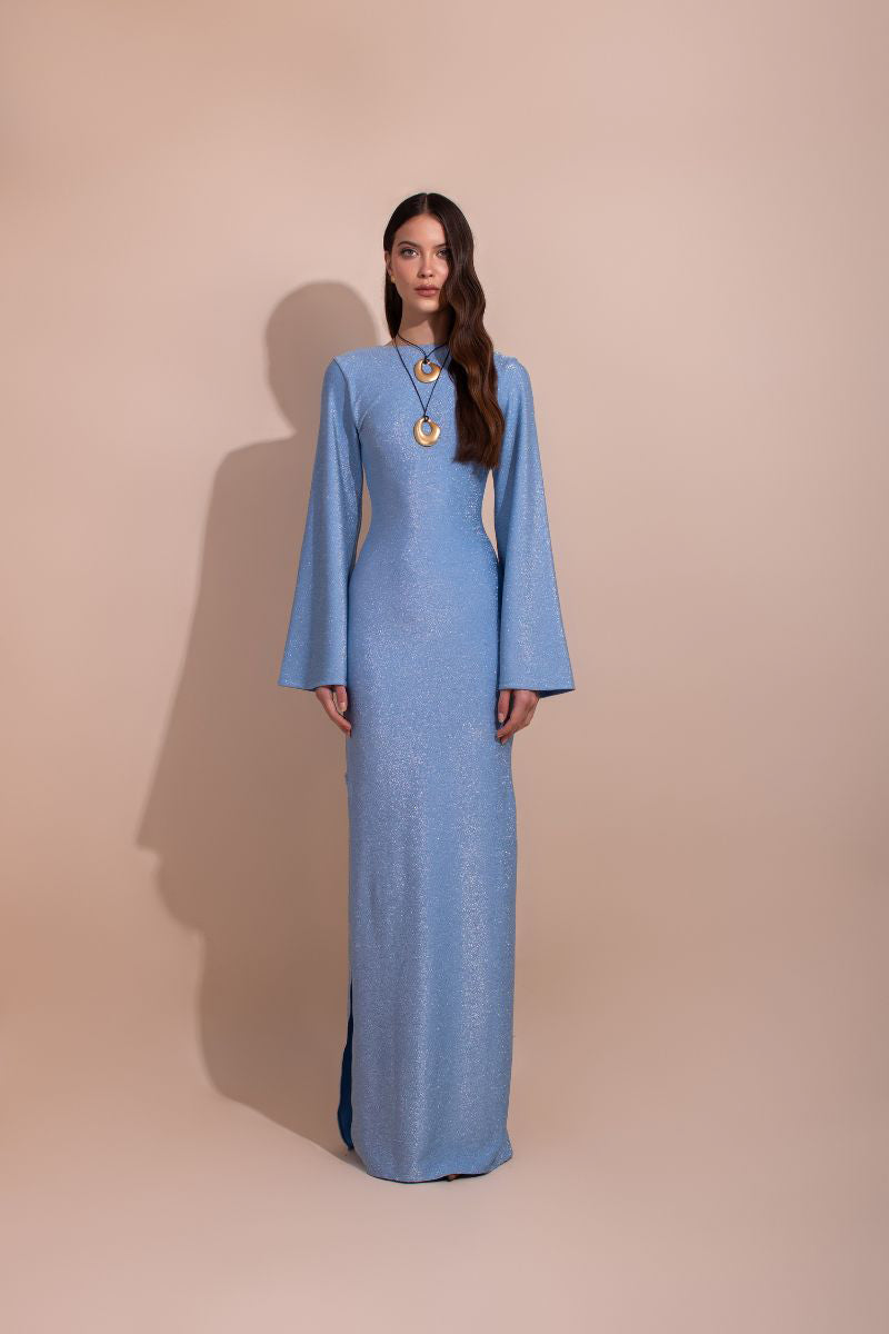 Blue Laura Escobar Baru long maxi dress with flowing fabric and elegant design, showcased on a model.