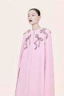 Nihan Peker Aura Pink Cape Gown featuring flowing fabric and elegant design, perfect for formal occasions.