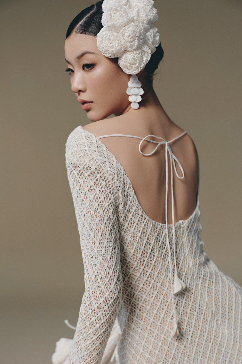 Keira Tong sculpted rose mini dress featuring a fitted silhouette and floral design, perfect for stylish occasions.