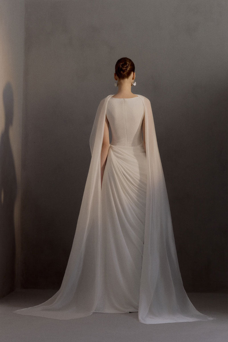 White Plan Regent Dress gown with elegant fabric and intricate details, displayed on a mannequin.