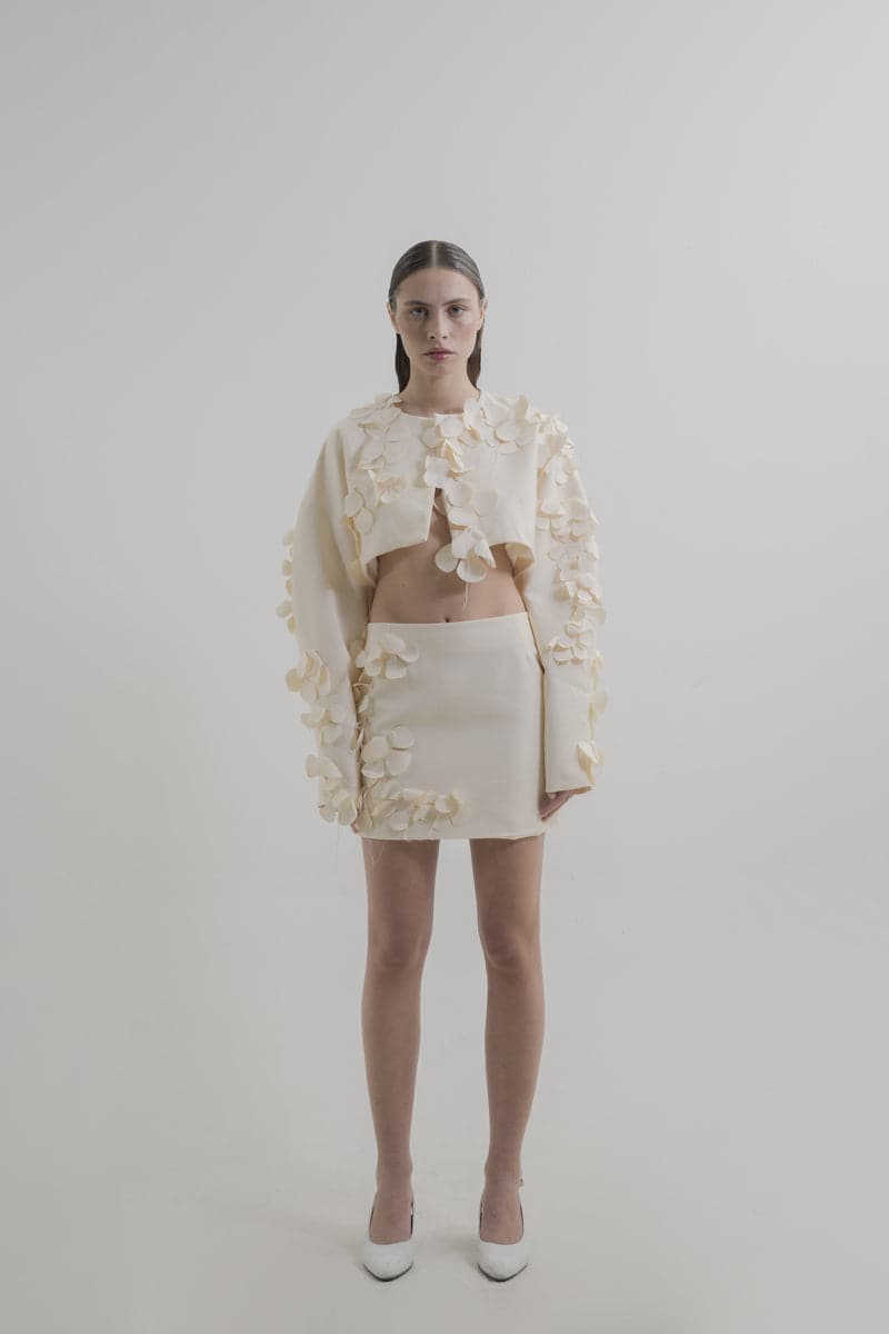Blikvanger Milky Floral Bolero jacket with delicate floral pattern, lightweight fabric, and elegant design for layered fashion.