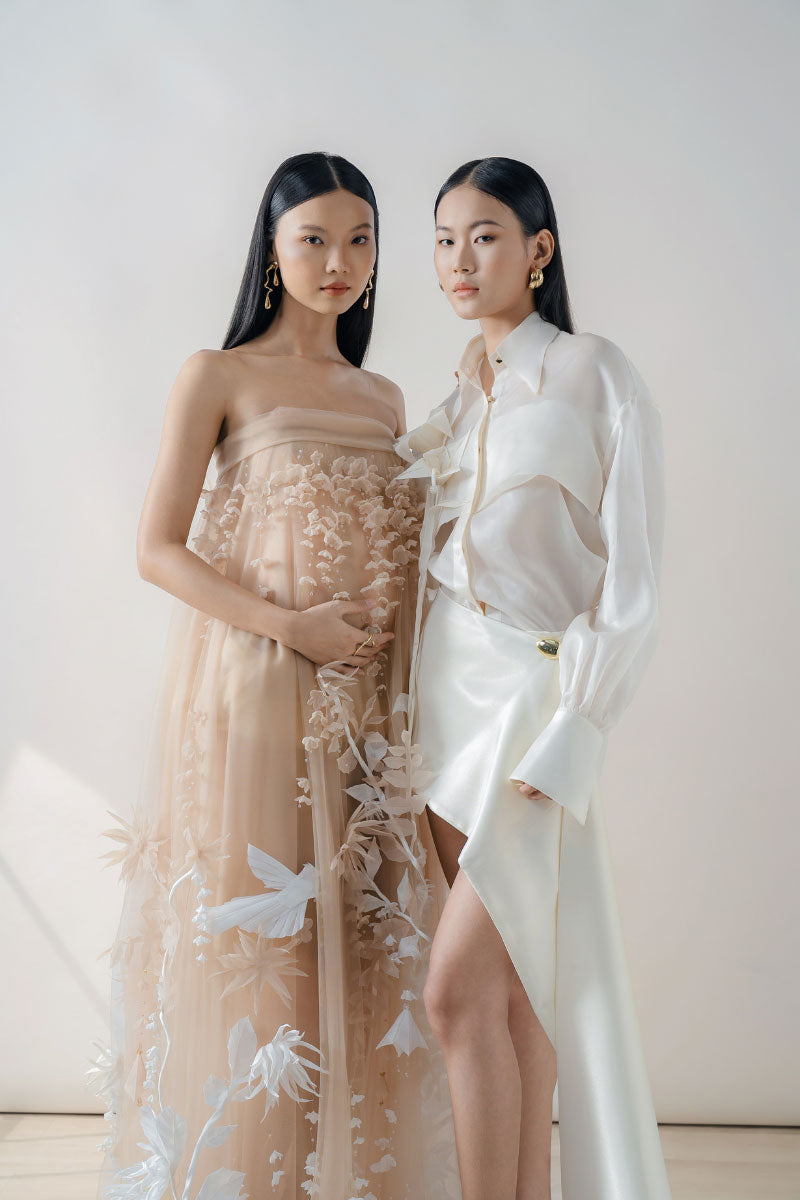 White sheer organza shirt from DOC BAN featuring a lightweight, transparent fabric and classic button-up design.