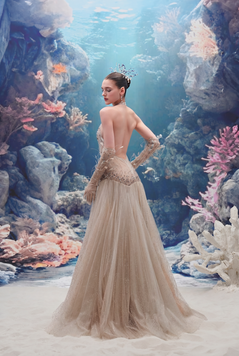 Beige Muriel glitter tulle gown with matching corisande glitter tulle gloves by 21Six, featuring elegant, shimmering fabric details.