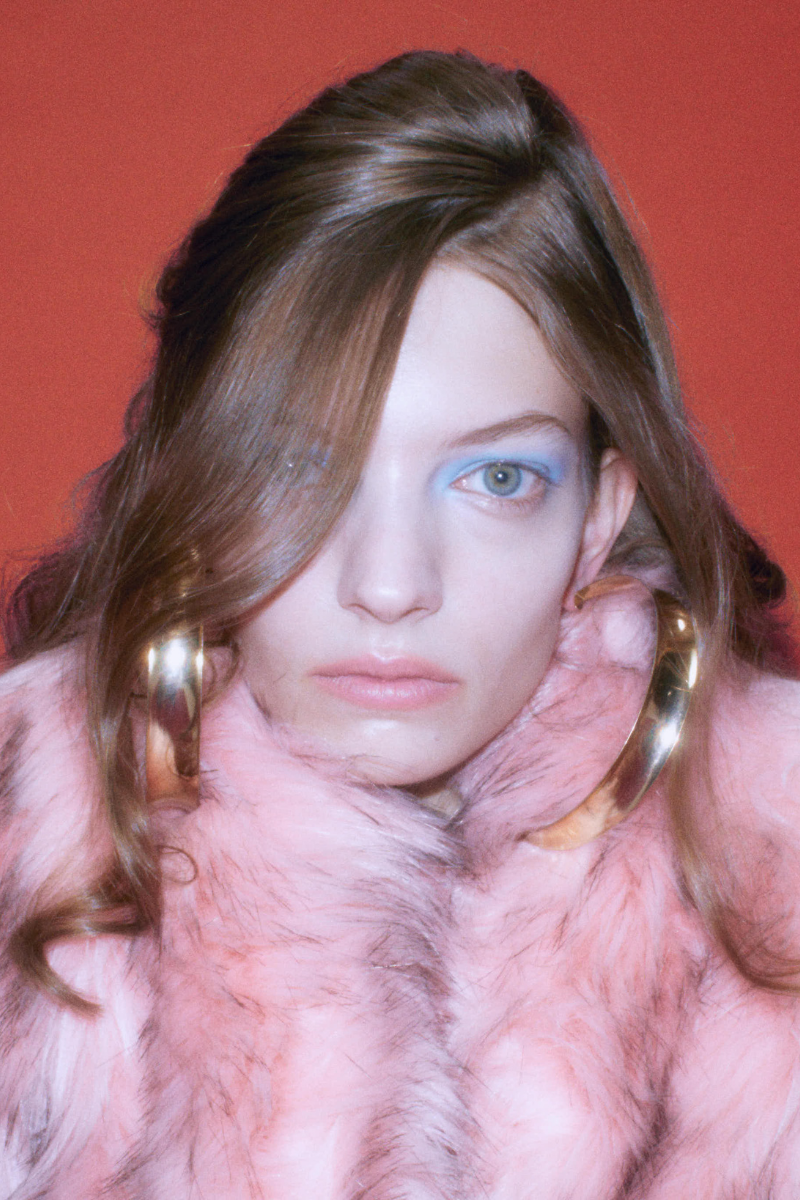 Sudi Etuz faux fur coat with attached scarf, stylish and cozy winter jacket with plush fur and matching scarf detail.
