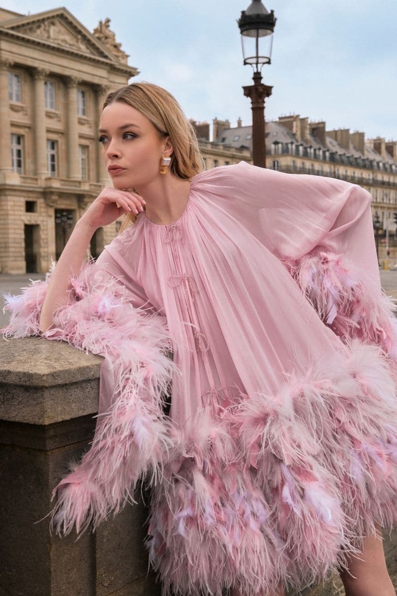 Pink Annie Chiffon Funnel Mini Dress by 21Six displayed on a hanger, showcasing its flowy fabric and stylish mini length.