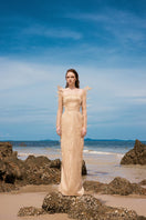 Beige Emily Crystal Lace Feather Gown by 21Six, featuring intricate lace details and feather accents, shown on a model.