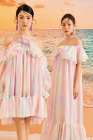 Rainbow Finley shiny silk maxi dress by 21Six featuring a vibrant rainbow pattern and flowing elegant design.