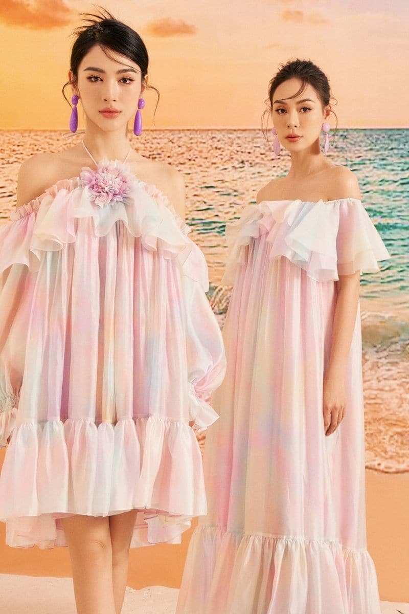Rainbow Finley shiny silk maxi dress by 21Six featuring a vibrant rainbow pattern and flowing elegant design.