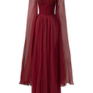 Red Esther silk cape gown by 21Six, featuring a flowing maxi dress with elegant cape details and a fitted silhouette.
