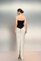 White and black Shamsa crepe and silk taffeta gown by 21Six, featuring elegant draping and a sophisticated design.