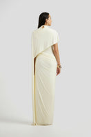 Deme By Gabriella Luciana Maxi Dress in off-white, flowing fabric with a relaxed fit and elegant design.
