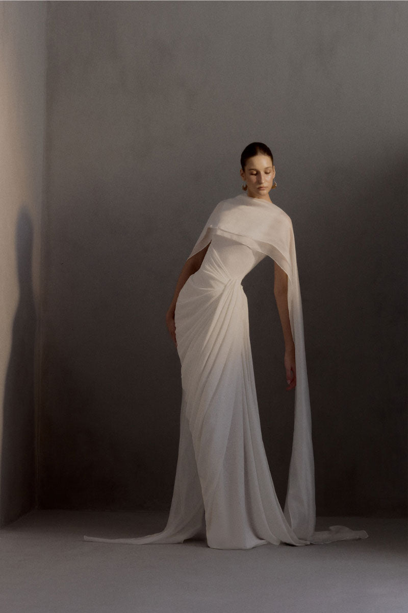 White Plan Regent gown, elegant long dress with detailed neckline and flowing fabric, suitable for formal occasions.